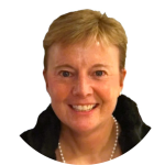 A smiling person with short blond hair, wearing a black top and a pearl necklace, is pictured against a plain white background. Sourcing, Procurement, 3rd Party Risk