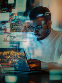 A man wearing glasses and a white sweater works on a laptop, surrounded by floating digital screens and data visualizations, highlighting a high-tech cybersecurity environment. Sourcing, Procurement, 3rd Party Risk